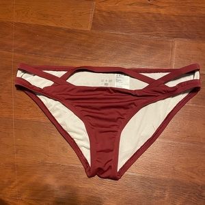 Women’s urban outfitters maroon bikini bottoms with strappy cut out.